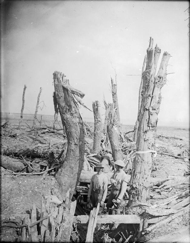 Two British soldiers standing in a wrecked German trench at Ginchy on the Somme in September 1916