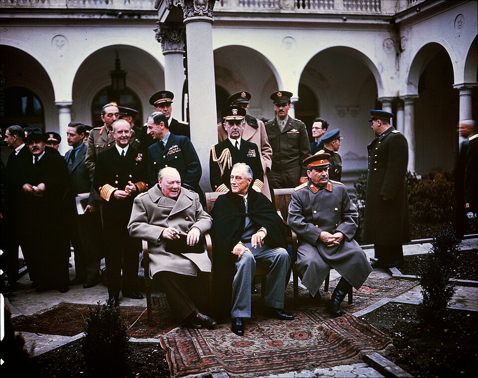 Winston Churchill, Franklin Roosevelt and Joseph Stalin seated together at the Yalta Conference in February 1945